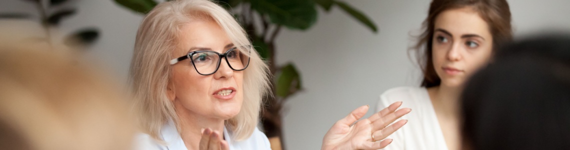 A woman talking during a work meeting.