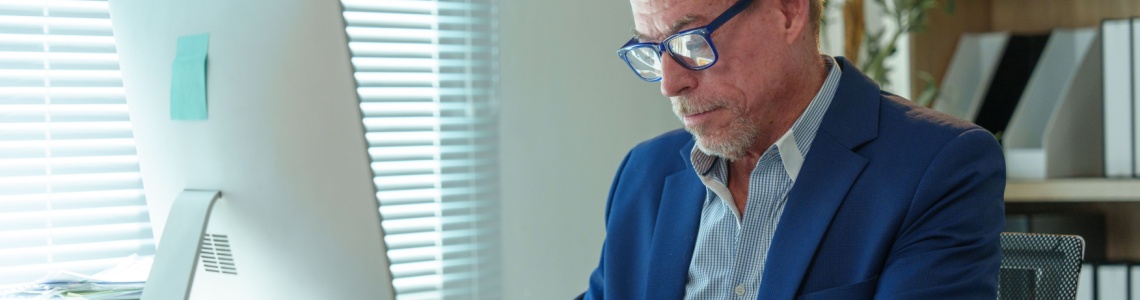 A man working at an office desk.