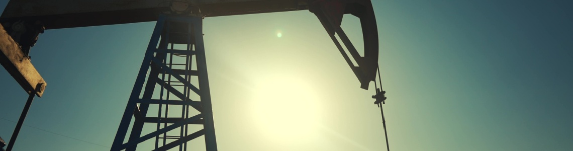 A silhouette of an oil pump.