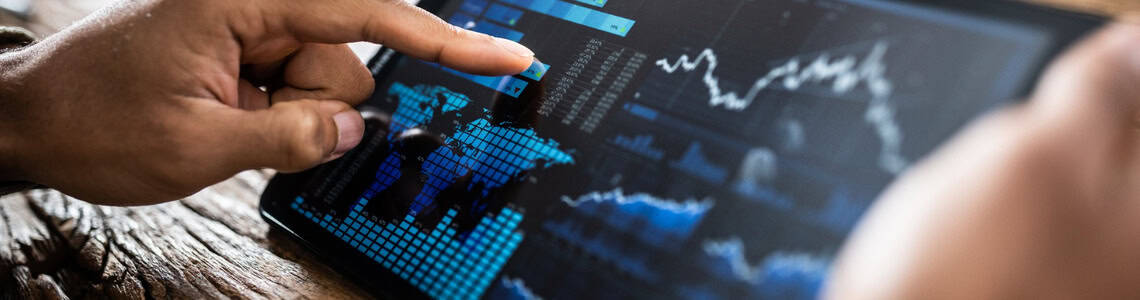 A person reviewing investment performance on a tablet.